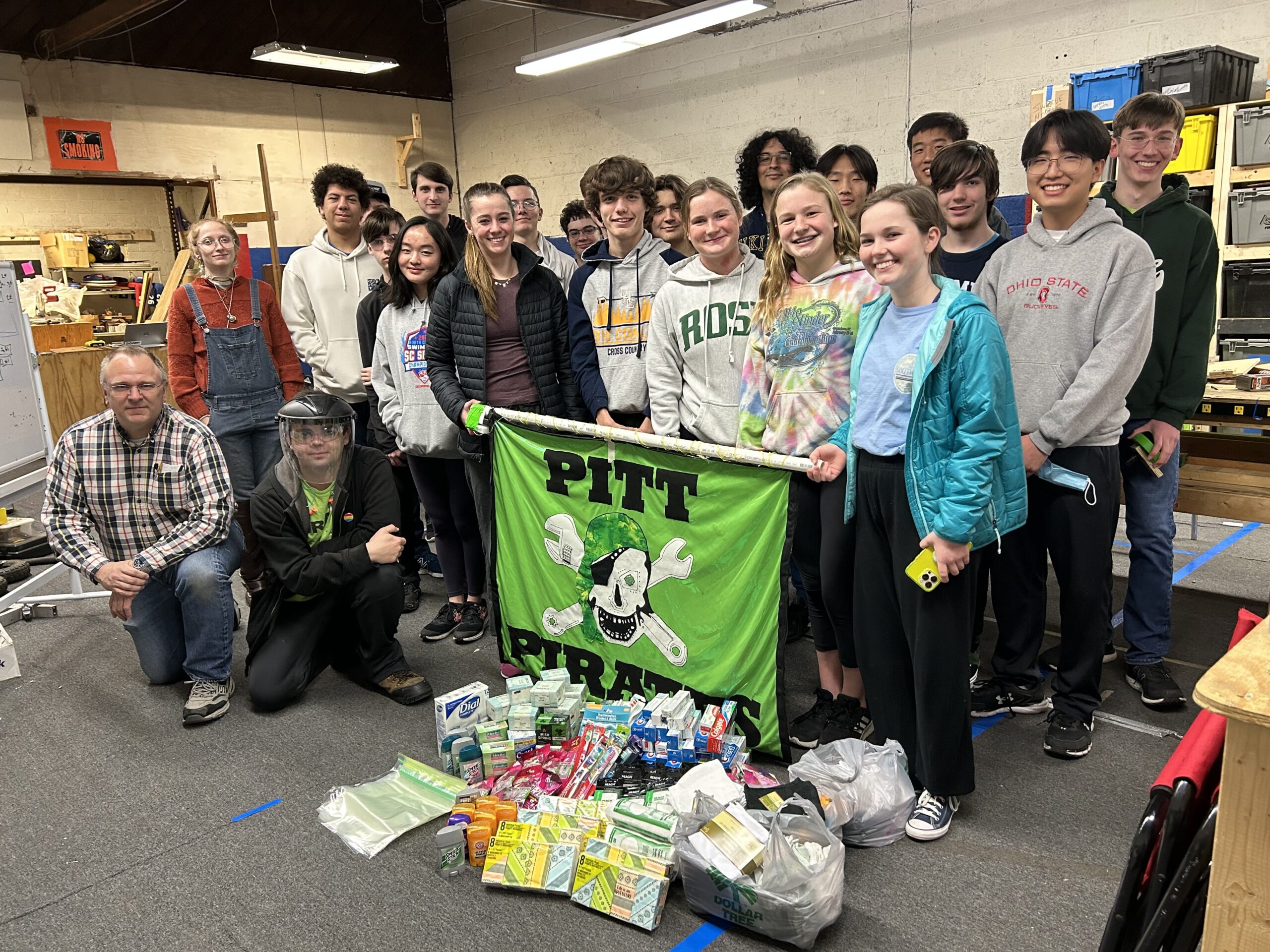 Pitt Pirates posing with donations